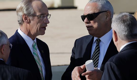 Former Secretary of State and retired four-star general Colin Powell, right, arrives for the dedication of the George W. Bush Presidential Center Thursday, April 25, 2013, in Dallas. (AP Photo/David J. Phillip) 