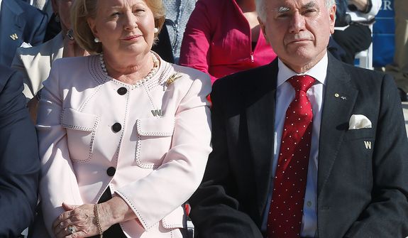 Former Australian Prime Minister John Howard and wife Janette attend the dedication of the George W. Bush presidential library on the campus of Southern Methodist University in Dallas, Thursday, April 25, 2013. (AP Photo/Charles Dharapak)
