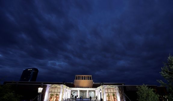 Production crews put the finishing touches on the stage before the dedication ceremony of the George W. Bush Presidential Center, Thursday, April 25, 2013, in Dallas. (AP Photo/David J. Phillip)