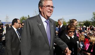 ** FILE ** Former Florida Gov. Jeb Bush and his wife Columba arrives for the dedication of the George W. Bush presidential library on the campus of Southern Methodist University in Dallas, Thursday, April 25, 2013. (AP Photo/Charles Dharapak)