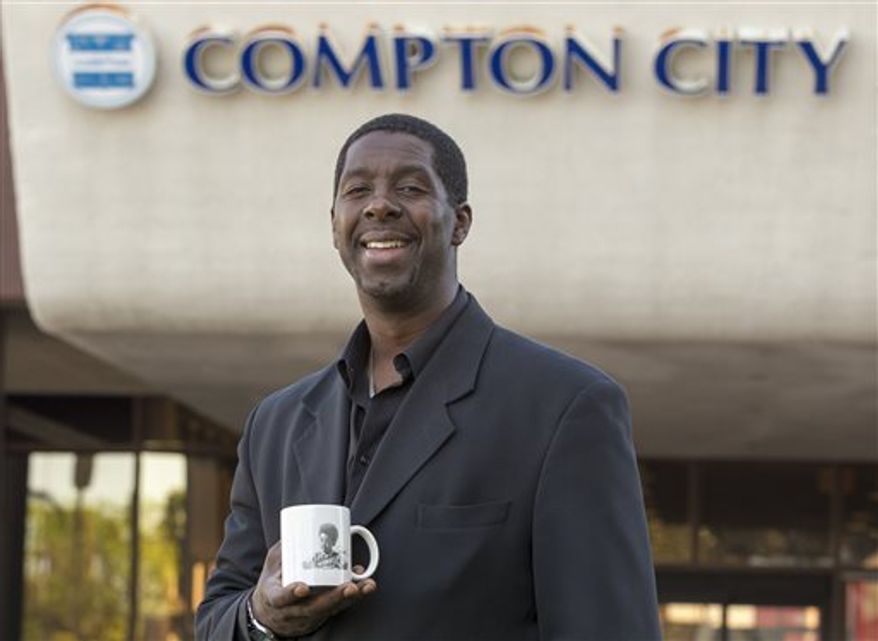 Former child actor Rodney Allen Rippy poses for a photo outside Compton City Hall in Compton, Calif. Rippy finished 10th of 12 candidates for Mayor of Compton in an election held earlier this month. (AP Photo/Damian Dovarganes)