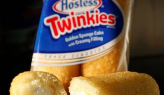 ** FILE ** This Jan. 10, 2012, file photo shows Hostess Twinkies in New York. Twinkies first came onto the scene in 1930 and contained real fruit until rationing during World War II led to the vanilla cream Twinkie. (AP Photo/Mark Lennihan, file)