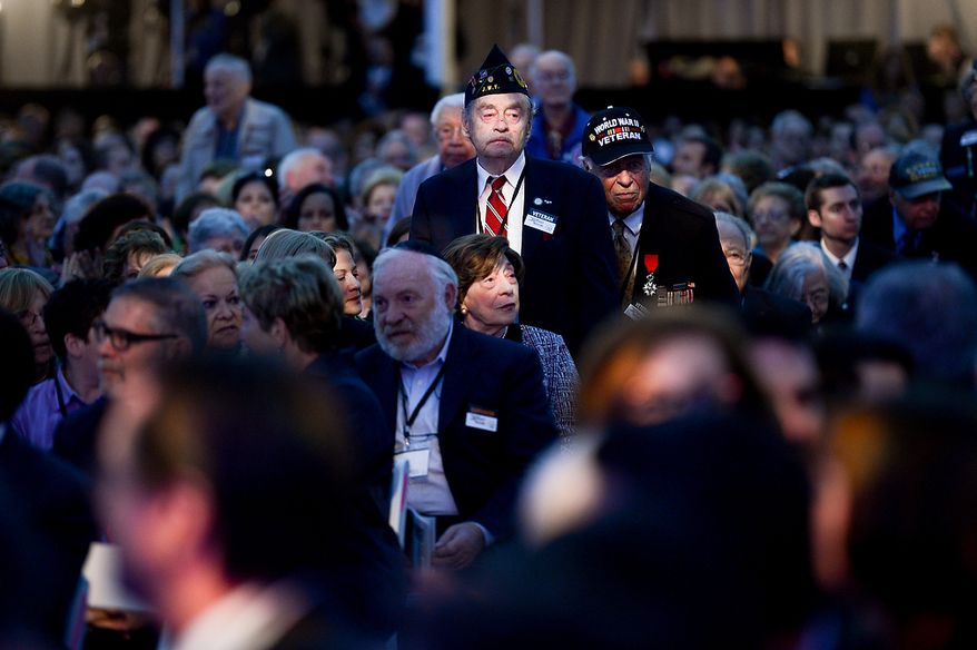 World War II veterans stand in the audience as they are recognized during the U.S. Holocaust Memorial Museum's 20th-anniversary commemoration and national tribute to Holocaust survivors and World War II veterans in Washington on Monday, April 29, 2013. (Andrew Harnik/The Washington Times)