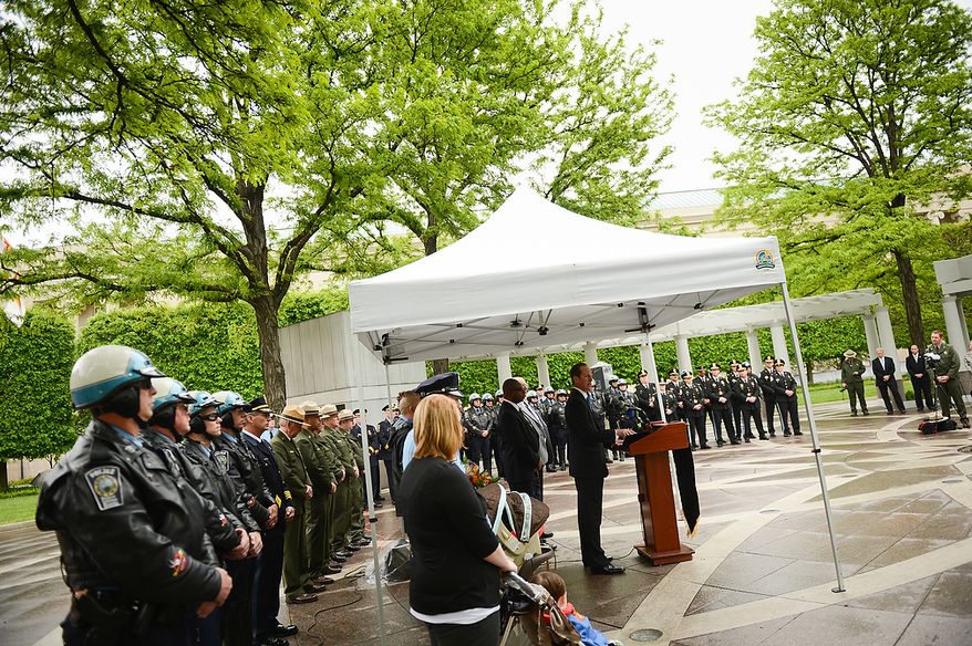 Police officers stand in line during a ceremony to unveil the name of slain Prince William County Police Officer Chris Yung on the wall of the National Law Enforcement Memorial, Washington, D.C., Monday, April 29, 2013. Yung was killed in a motorcycle accident while responding to a separate car crash New Years Eve last year. (Andrew Harnik/The Washington Times)
