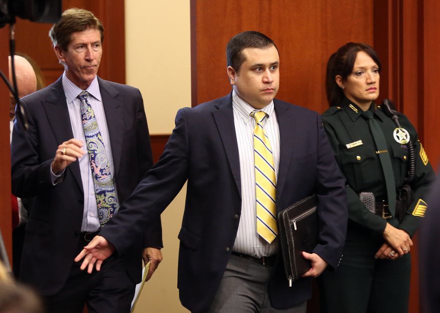 George Zimmerman, defendant in the killing of Trayvon Martin, arrives in Seminole circuit court, in Sanford, Fla., with his attorney Mark O'Mara, left, for a pre-trial hearing, Tuesday, April 30, 2013. (AP Photo/Orlando Sentinel, Joe Burbank, Pool)