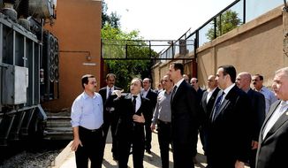 Syrian President Bashar Assad makes a rare public appearance Wednesday with a visit to the Umayyad Electrical Station in Damascus, the day after a large explosion.