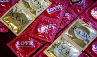 AIDS Healthcare Foundation condoms during a Valentine&#39;s Day press conference to introduce a statewide law requiring condom use by adult film performers on Feb. 14, 2013, in Los Angeles. (Associated Press/AIDS Healthcare Foundation) **FILE** 