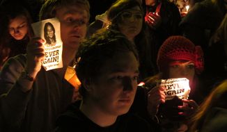 Protesters for abortion rights hold a vigil for Savita Halappanavar outside Ireland&#39;s government headquarters in Dublin on Saturday, Nov. 17, 2012. (AP Photo/Shawn Pogatchnik)
