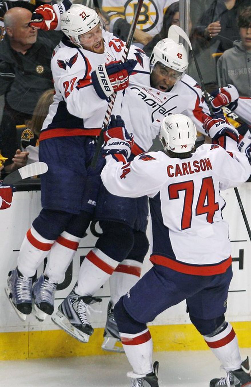 Joel Ward (center) scored the game-winning goal in Game 7 of last year's playoff matchup against Boston. (Associated Press)