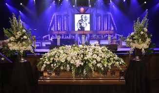 The casket of country music legend George Jones sits in the Grand Ole Opry House before his funeral on Thursday, May 2, 2013, in Nashville, Tenn. Mr. Jones, one of country&#x27;s biggest stars, who had No. 1 hits in four different decades, died Friday at age 81. (AP Photo/Mark Humphrey, Pool)