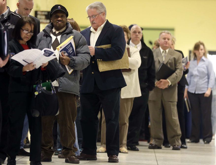 In this Thursday, April 11, 2013, photo, people wait in line before the Dr. King Career Fair at the Empire State Plaza Convention Center in Albany, N.Y. (AP Photo/Mike Groll)