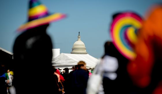 Visitors wear colorful Mexican hats at the annual Cinco de Mayo celebration on the National Mall in Washington on Sunday, May 5, 2013. (Andrew Harnik/The Washington Times)