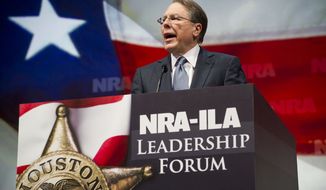 Wayne LaPierre, executive vice president and chief executive officer of the National Rifle Association, speaks during a leadership forum at the group&#39;s annual meeting on Friday, May 3, 2013, in Houston. (AP Photo/Steve Ueckert)

