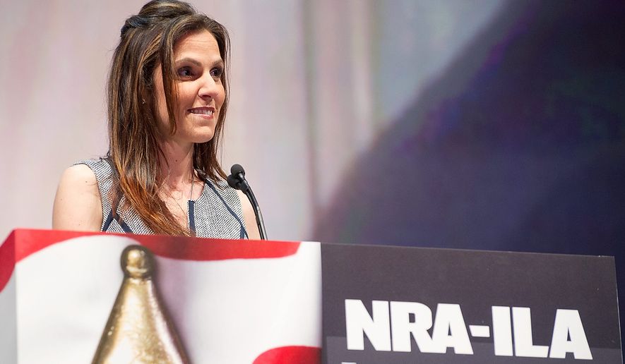 Taya Kyle, widow of author and former Navy SEAL sniper Chris Kyle, speaks during the leadership forum at the National Rifle Association&#39;s annual convention in Houston on May 3, 2013. (Associated Press) **FILE**