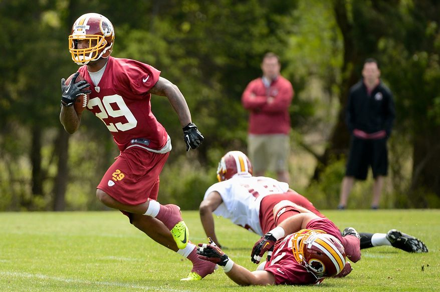 Washington Redskins safety Bacarri Rambo (29) runs with the ball after making an interception during a scrimmage at the team's rookie minicamp at Redskins Park in Ashburn, Va., on Sunday, May 5, 2013. (Andrew Harnik/The Washington Times)