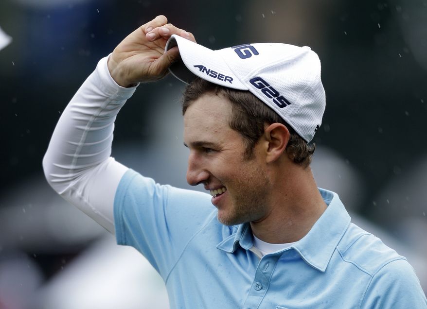 Derek Ernst tips his cap after winning the Wells Fargo Championship golf tournament at Quail Hollow Club in Charlotte, N.C., Sunday, May 5, 2013. Ernst defeated David Lynn on the first playoff hole. (AP Photo/Bob Leverone)