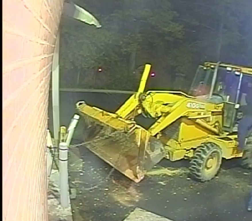 Thieves used a backhoe in an attempt to pry an ATM machine from a bank in Potomac (Photo courtesy of Montgomery County police)