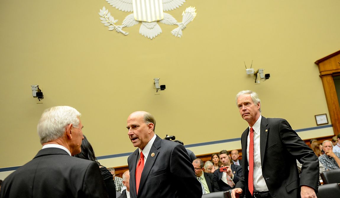 Sen. Ron Johnson (R-Wis.), right, the senator who former Secretary of State Hillary Clinton yelled at during a senate hearing on the attacks in Benghazi, and Rep. Louie Gohmert (R-Texas), center, arrive before a House Oversight and Government Reform Committee hearing on the September 11, 2012 attack in Benghazi, Libya on Capitol Hill, Washington, D.C., Wednesday, May 8, 2013. (Andrew Harnik/The Washington Times)