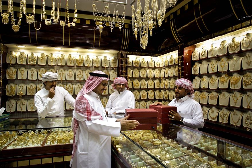 Analysts debate whether gold prices could rebound toward the record high of nearly $1,900 an ounce, as central governments and investors look to the commodity as a safe bet in an unsteady world economy. (Associated Press)