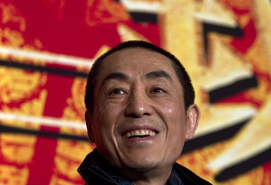 ** FILE ** In this Dec. 22, 2010, file photo, Chinese director Zhang Yimou smiles during a press conference to promote his new movie in Beijing. Media reports circulated online this week that Zhang Yimou, who is also known as the architect of the opening ceremony for the Beijing Olympics, has seven children from his two marriages and from relationships with two other women. (AP Photo/Alexander F. Yuan, File)