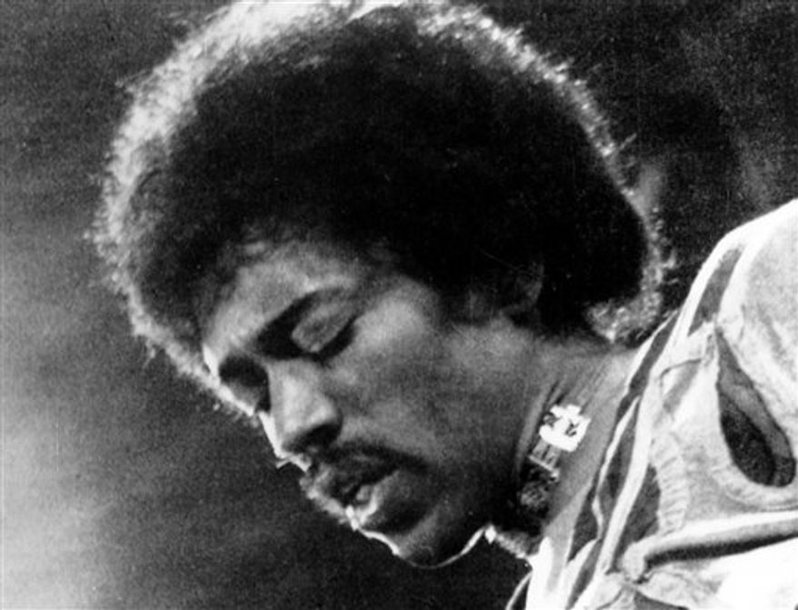 In this 1970 file photo, Jimi Hendrix performs on the Isle of Wight in England. (AP Photo/File)