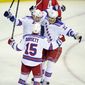 New York Rangers left wing Taylor Pyatt (14) celebrates his goal with Derek Dorsett (15) and Brian Boyle (22) during the second period of Game 7 first-round NHL Stanley Cup playoff hockey series against the Washington Capitals, Monday, May 13, 2013, in Washington. (AP Photo/Nick Wass)