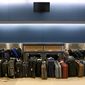 ** FILE ** Luggage waits to be run through the baggage system for testing in the new Maynard Holbrook Jackson Jr. International Terminal at the Hartsfield–Jackson Atlanta International Airport on March 28, 2012. (AP Photo/David Goldman)




