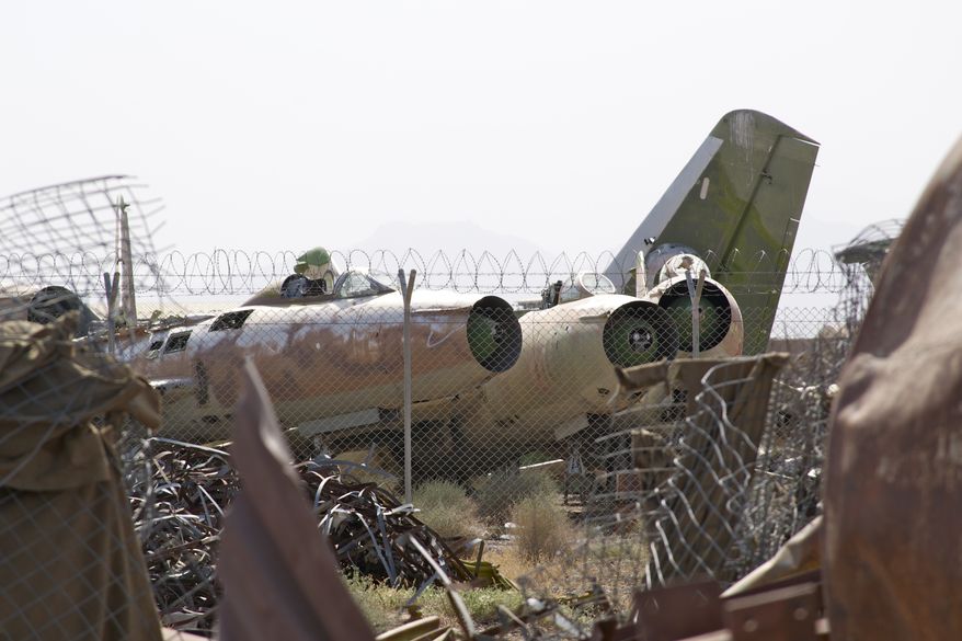Known as the "Shindand boneyard," scraps of Soviet aircraft from the 1980s litter the landscape at Shindand Air Base, an Afghan military base in the westernmost province of Herat. (Kristina Wong/The Washington Times)