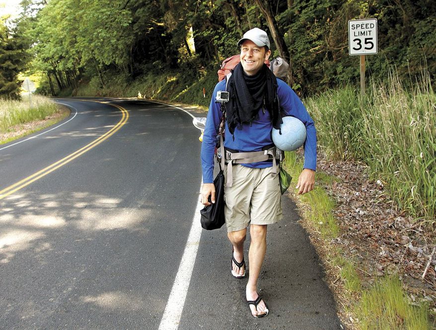 In this May 7, 2013, photo, Richard Swanson, of Seattle, walks along a road in Kelso, Wash. Swanson, who was trying to dribble a soccer ball to Brazil in time for the 2014 World Cup, died Tuesday, May 14, 2013, after being hit by a pickup truck on the Oregon Coast. (AP Photo/The Daily News, Bill Wagner)
