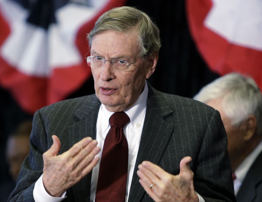 FILE - In this Jan. 23, 2013, file photo, MLB Commissioner Bud Selig speaks at a news conference at Great American Ballpark in Cincinnati. Selig told the Associated Press Sports Editors on Thursday, April 25, that baseball won't change its schedule to boost the sport's chances of getting back into the Olympics. (AP Photo/Al Behrman, File)