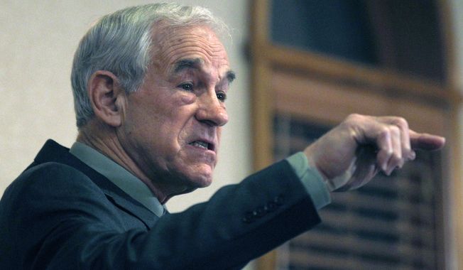 ** FILE ** Then-Rep. Ron Paul, Texas Republican, speaks during a campaign stop in Manchester, N.H., on Dec. 19, 2011, during his bid for the party&#x27;s presidential nomination. (Associated Press)
