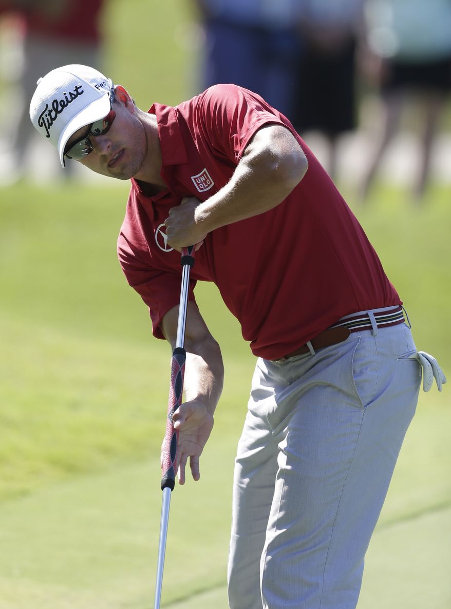 FILE - In this May 9, 2013 file photo, Adam Scott of Australia putts on the 15th green during the first round of The Players championship golf tournament at TPC Sawgrass in Ponte Vedra Beach, Fla. Golf's governing bodies have adopted a new rule that outlaws the putting stroke used by four of the last six major champions. The Royal & Ancient Golf Club and U.S. Golf Association announced Tuesday, May 21, 2013 that Rule 14-1b would start in 2016. The new rule will make it illegal to anchor the club against the body when making a golf stroke. (AP Photo/Chris O'Meara, File)