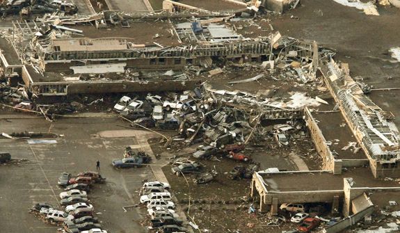 This aerial photo shows damage to Moore Medical Center after it was hit by a massive tornado in Moore, Okla., Monday May 20, 2013. A tornado roared through the Oklahoma City suburbs Monday, flattening entire neighborhoods, setting buildings on fire and landing a direct blow on an elementary school. (AP Photo/Steve Gooch)