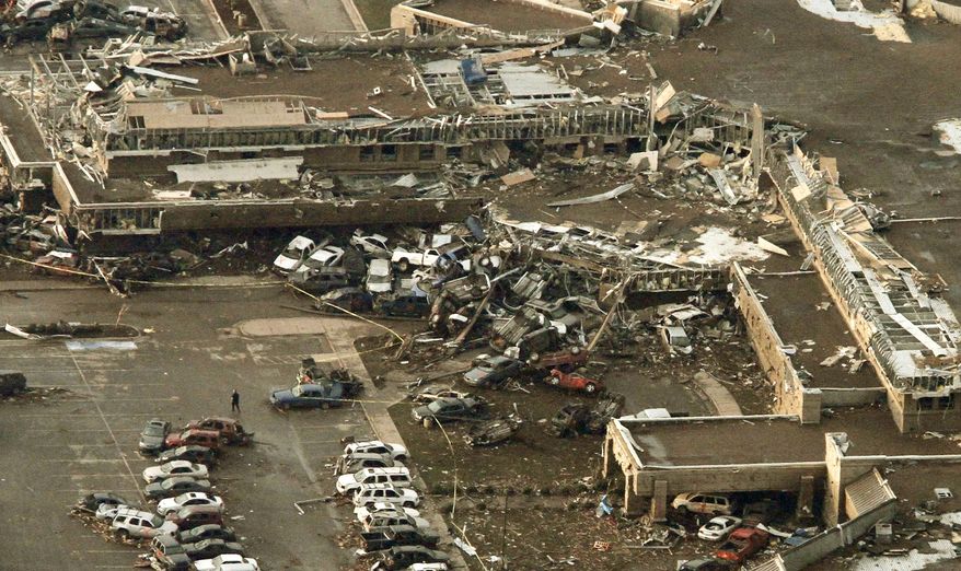 This aerial photo shows damage to Moore Medical Center after it was hit by a massive tornado in Moore, Okla., Monday May 20, 2013. A tornado roared through the Oklahoma City suburbs Monday, flattening entire neighborhoods, setting buildings on fire and landing a direct blow on an elementary school. (AP Photo/Steve Gooch)