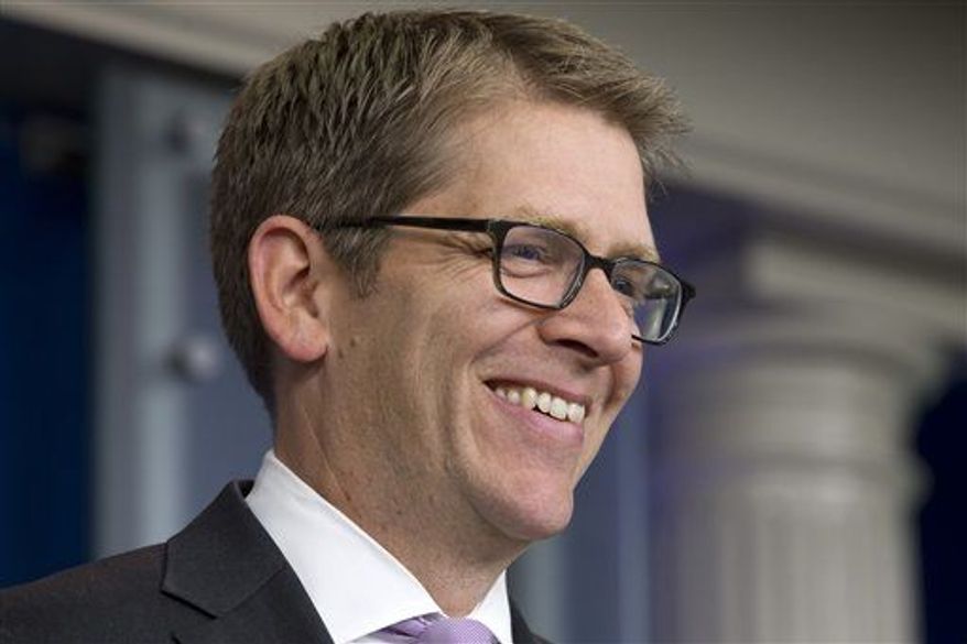 White House Press Secretary Jay Carney smiles after being wished a happy birthday by a reporter during his daily news briefing at the White House in Washington, Wednesday, May 22, 2013. At the briefing Carney announced that President Obama will travel to Oklahoma to visit tornado affected communities. (Associated Press)