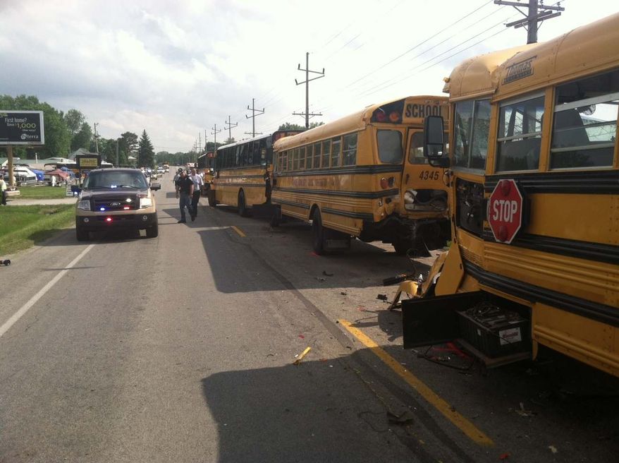 This image provided by the Kosciusko County Sheriff's Department shows a chain-reaction crash involving four buses in North Webster, Ind., Wednesday, May 22, 2013 The crash left dozens of middle and high school students with non-serious injuries and one driver seriously injured. (AP Photo/Kosciusko County Sheriff's Department)