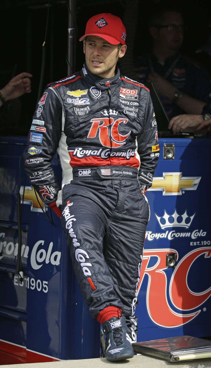 In this photo taken on Wednesday, May 15, 2013, Marco Andretti sits in his pit box during practice for the Indianapolis 500 auto race at the Indianapolis Motor Speedway in Indianapolis. Andretti went into the Indianapolis 500 last year believing the race was his to lose. Well, he lost and the Andretti Curse lives. Now off to his best start, he could become the first Andretti to win the showcase race since his grandfather in 1969. (AP Photo/Michael Conroy)