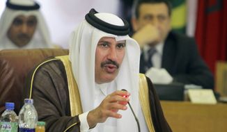 Qatari foreign minister Sheik Hamad bin Jassim al-Thani talks during an Arab League committee emergency meeting on Syria at the league’s headquarters in Cairo, Egypt, Thursday, May 23, 2013, ahead of an international peace conference to end the country’s civil war. (AP Photo/Amr Nabil)