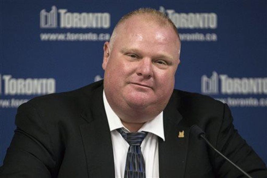 Toronto Mayor Rob Ford reads a statement to the media at City Hall on Friday, May 24, 2013 in Toronto. Ford denied that he smokes crack cocaine and says he is not an addict after a video purported to show him using the drug. Ford did not say whether he has ever used the drug. (AP Photo/The Canadian Press, Chris Young)