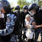 Riot police stop Orthodox protesters who are trying to stop Ukraine&#39;s first gay pride demonstration in Kiev, Ukraine, Saturday, May 25, 2013. (AP Photo/Sergei Chuzavkov)