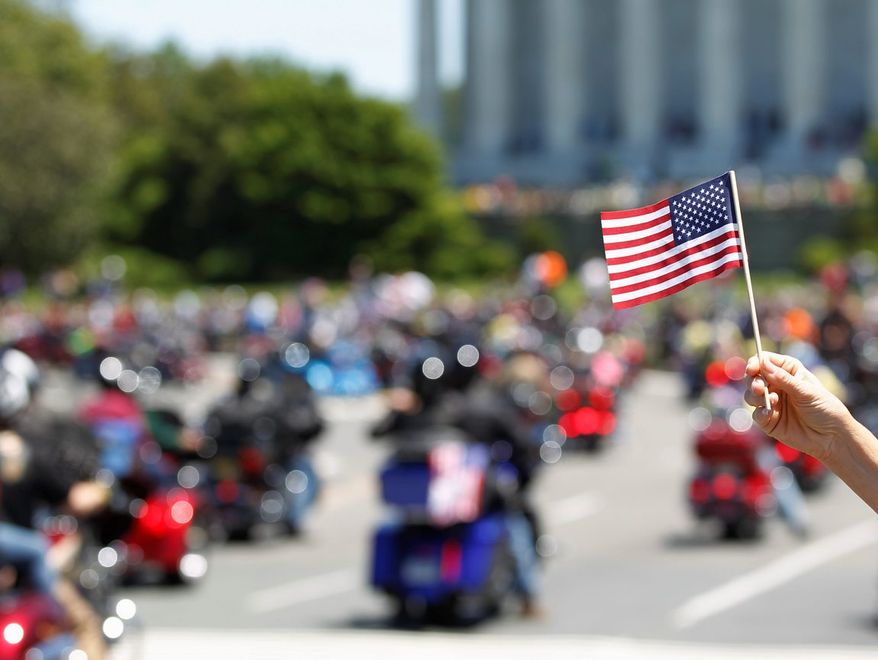 Motorcyclists ride across Memorial Bridge into Washington during the Rolling Thunder "Ride for Freedom" parade Sunday.
(Associated Press)