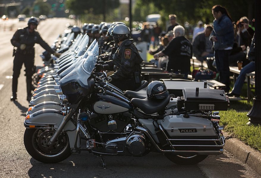 Fairfax county motorcycle police park their bikes in a precise line, outside the Patriot Harley-Davidson in preparation to escort rides in the annual Ride of the Patriots, in support of Rolling Thunder, in Fairfax, VA., Sunday, May 26, 2013.  (Andrew S Geraci/The Washington Times)