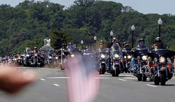 Motorcycles drive over the Memorial Bridge during the annual Rolling Thunder &quot;Ride for Freedom&quot; parade ahead of Memorial Day in Washington, Sunday, May 26, 2013. (AP Photo/Molly Riley)