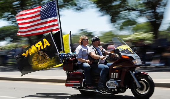 Motorcycle riders participate in the annual Rolling Thunder &quot;Ride for Freedom&quot; ahead of Memorial Day in Washington, Sunday, May 26, 2013. (AP Photo/Molly Riley)  