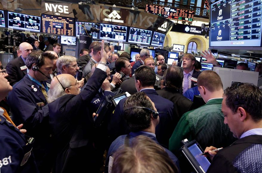 For many investors, the more than halving of the deficit from a high of $1.55 trillion during the depths of the recession is the latest sign that the economy finally has turned the corner and is on a solidly upward path. (Associated Press)