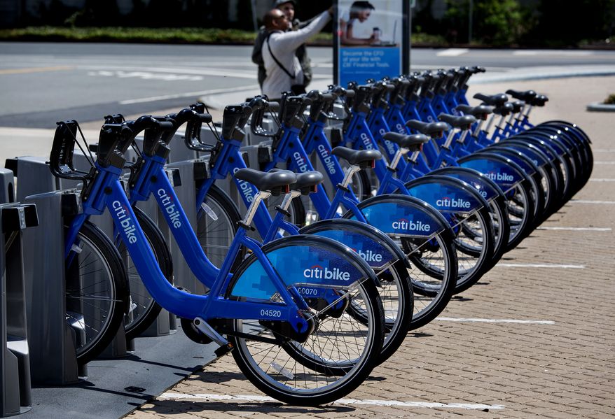 **FILE** Bicycles from the NYC Bike Share program are lined up at a dock-and-lock station at the Brooklyn Navy Yards in New York on May 12, 2013. The expanding bike share system allows those who join to ride bicycles and return them from the same or different docks in parts of New York. (Associated Press)