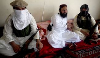 ** FILE ** Waliur Rehman (center), the Pakistani Taliban&#39;s No. 2 leader, talks with The Associated Press during an interview in Shawal area of South Waziristan along the Afghanistan border in Pakistan on July 28, 2011. (AP Photo/Ishtiaq Mahsud)