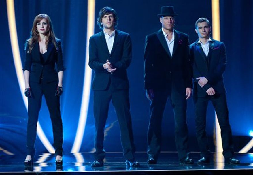 From left, Isla Fisher, Jesse Eisenberg, Woody Harrelson and Dave Franco in a scene from "Now You See Me." (AP Photo/ Summit Entertainment, Barry Wetcher)