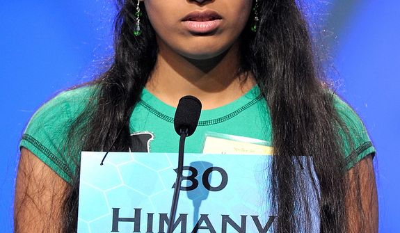 Himanvi Kopuri, 12 of Denver, spells &quot;stupefacient&quot; during the semi-final round of the Scripps National Spelling Bee in Oxon Hill, Md., Thursday, May 30, 2013. (AP Photo/Cliff Owen)