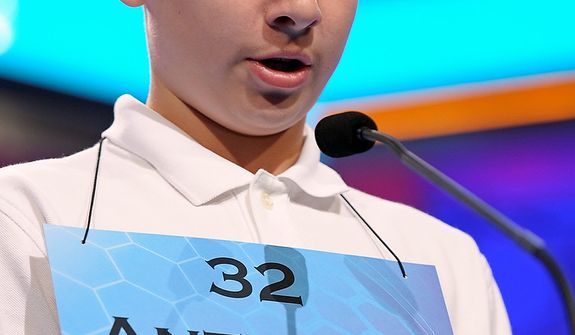 Anthony Constantine, 13, of Milford, Ct.,  spells his word during the second round of the  Scripps National Spelling Bee in Oxon Hill, Md., Wednesday, May 29, 2013. (AP Photo/Cliff Owen)